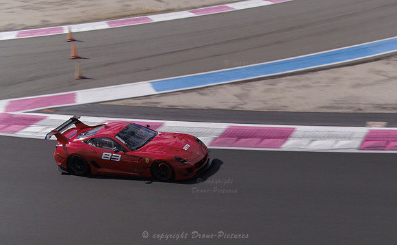 Prise de vue par drone d'une Ferrari 83 rouge à pleine vitesse sur le Circuit Paul Ricard du Castellet vu par Drone-Pictures pour Ferrari en Septembre 2020
